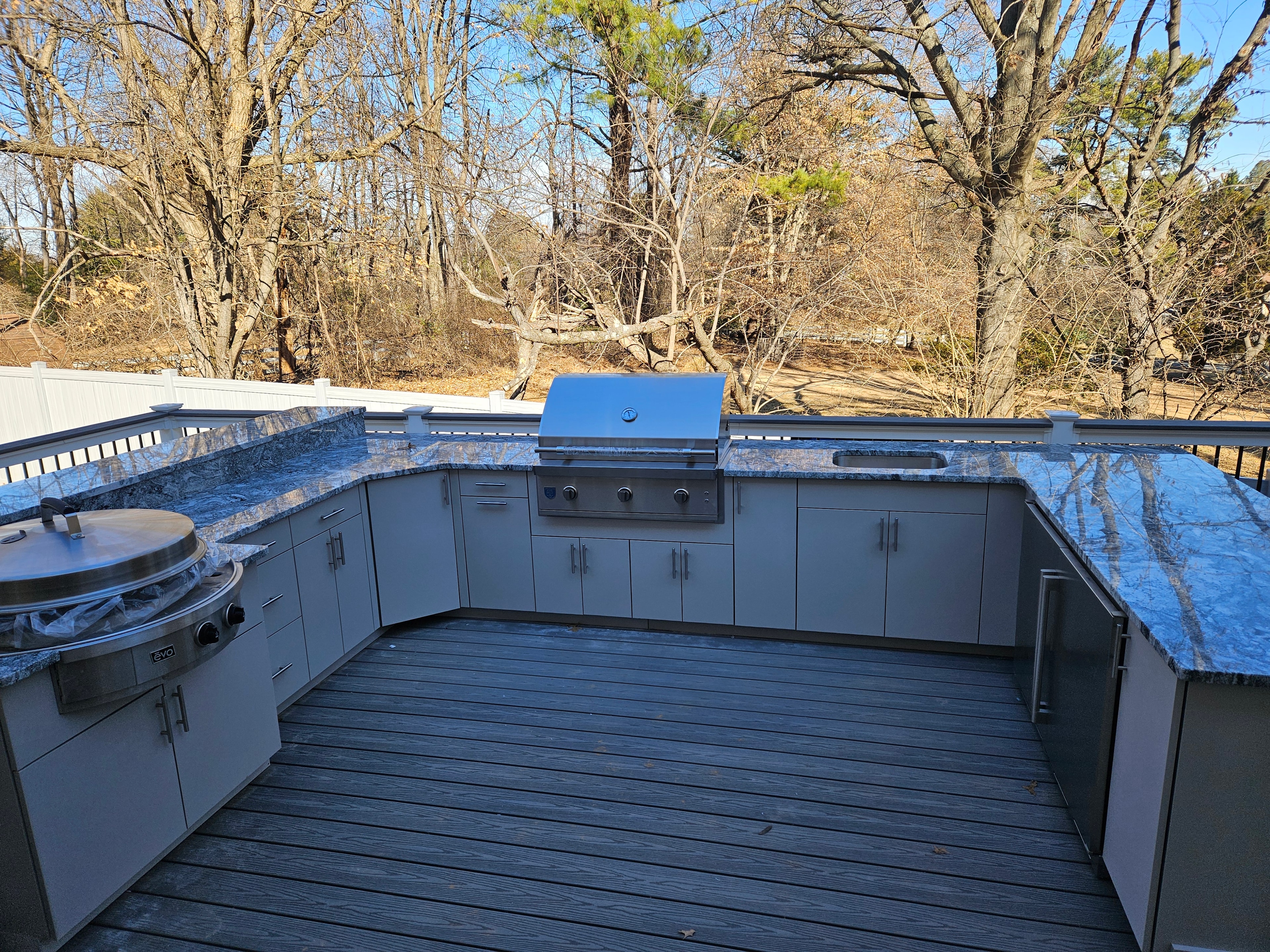 Completed installation — HDPE cabinetry and integrated cooking zone